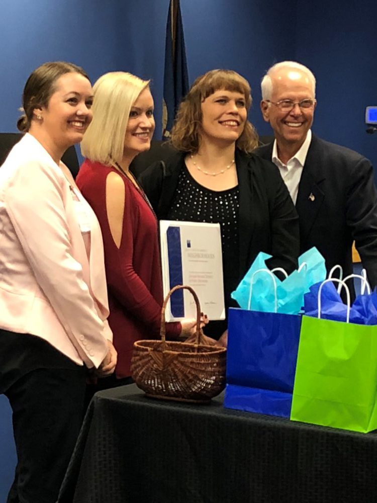 Courtney McLemore, Rebecca Blaine, Danielle Barker and Mayor Steve Gentling celebrate Guthrie named a Great Place in America by the American Planning Association